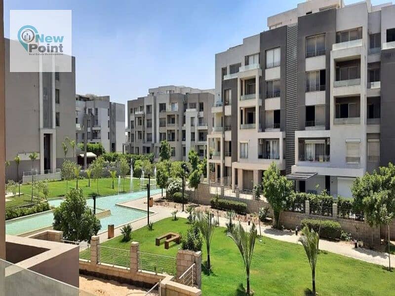 Ground floor apartment with garden for sale in Palm Hills New Cairo, Cleo phase, direct on the lagoon, with installments over 8 years 1