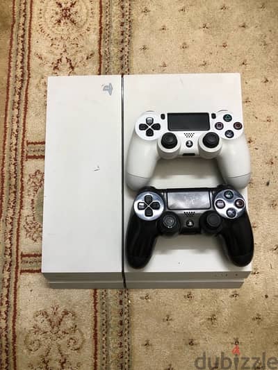 white PS4 500 GB with 2 joysticks