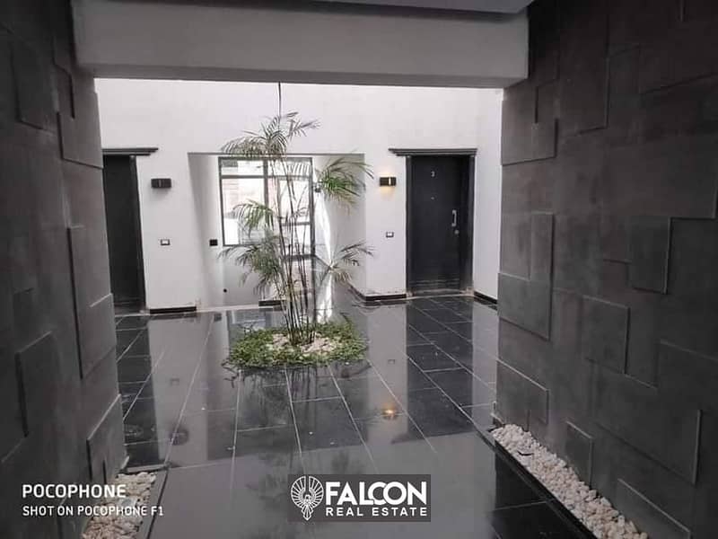 For sale, a 136 m² master bedroom apartment with an open view in front of Cairo Airport on the Suez Direct Road, with a 42% discount and facilities 32