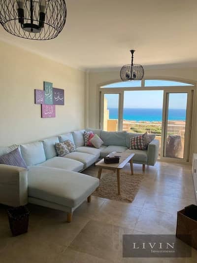 Fully finished two-bedroom chalet for sale in Telal Ain Sokhna Compound, direct sea view, at the best price with a down payment and installments