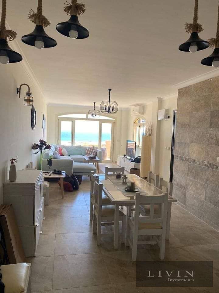 Fully finished two-bedroom chalet for sale in Telal Ain Sokhna Compound, direct sea view, at the best price with a down payment and installments 1