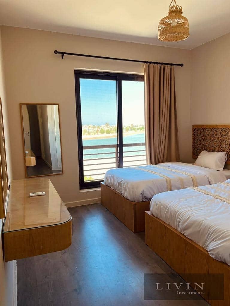 Fully finished two-bedroom chalet for sale in Telal Ain Sokhna Compound, direct sea view, at the best price with a down payment and installments 2