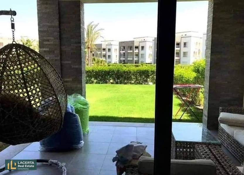 Apartment for sale, 131 sqm, open to a garden, in front of the airport and on Suez Road, installments for 8 years, in Taj City, Cairo 0