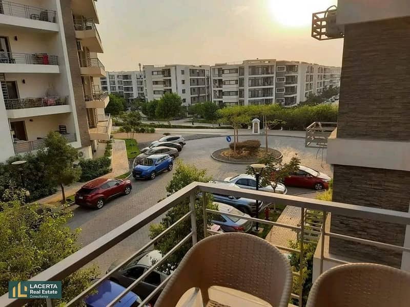 Apartment for sale, 131 sqm, open to a garden, in front of the airport and on Suez Road, installments for 8 years, in Taj City, Cairo 4