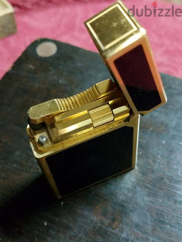 S. T Dupont mini lighter. . . ولاعه اس تي ديبو ميني لاكار 5