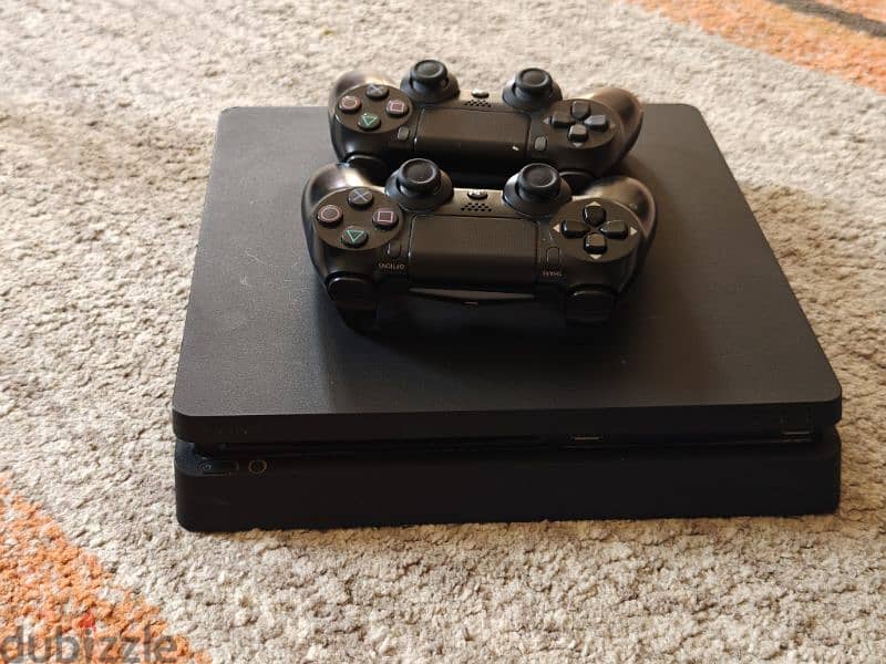 Play station 4 with Two controllers in perfect condition 0