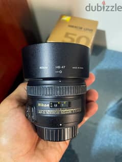 عدسة نيكون 50mm 1.4 0