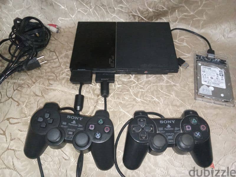 بلايستيشن ٢ متعدل بهارد ٥٠٠ جيجا عليه ٢٠٠ لعبة ودراعين وميموري ps2 0