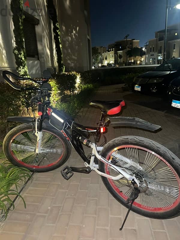 adult bicycle with drink holder and two bags 1