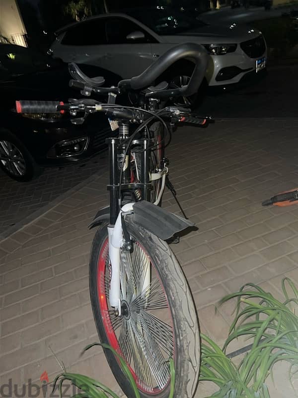 adult bicycle with drink holder and two bags 2