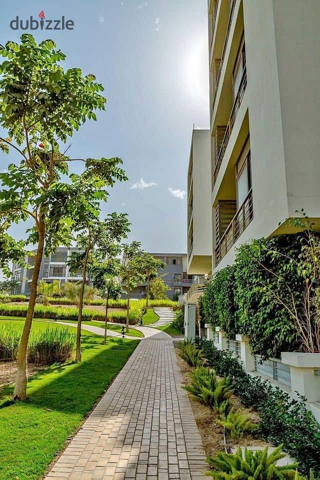 Studio with private garden for sale in the first settlement in front of the airport in Taj City Compound 5