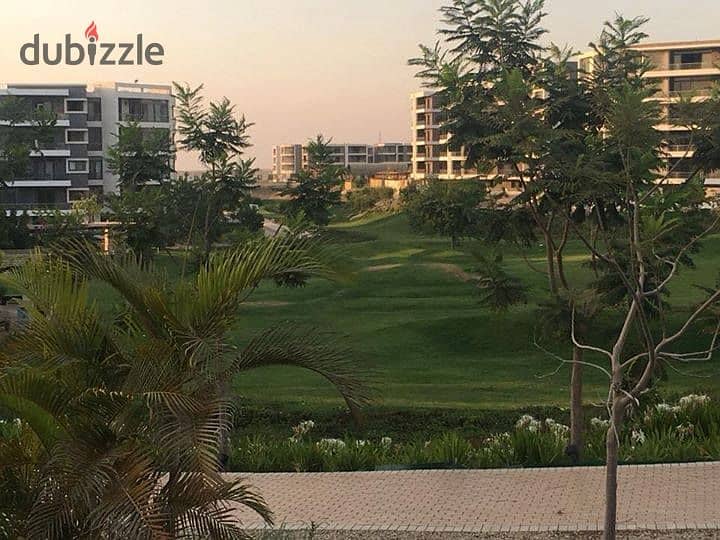 Studio with private garden for sale in the first settlement in front of the airport in Taj City Compound 10