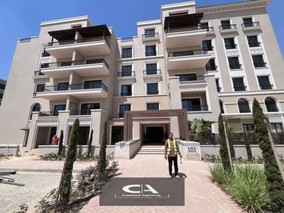 Over the cityscape, an apartment for sale in a garden, fully finished, with the real estate developer, Dorra, in the heart of New Zayed, in the Villag