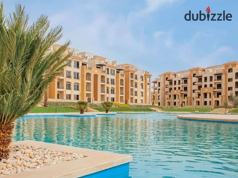 Ground floor apartment with garden for sale in Stone Residence Compound, Fifth Settlement, immediate receipt and direct lake view, area of ​​two rooms 0