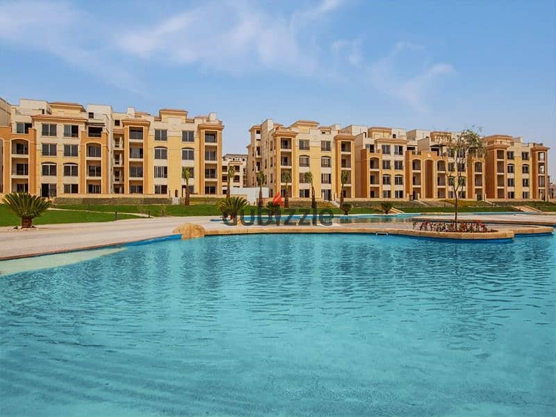 Ground floor apartment with garden for sale in Stone Residence Compound, Fifth Settlement, immediate receipt and direct lake view, area of ​​two rooms 2