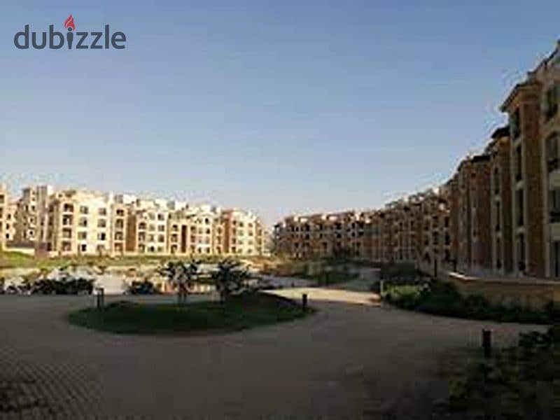 Ground floor apartment with garden for sale in Stone Residence Compound, Fifth Settlement, immediate receipt and direct lake view, area of ​​two rooms 8