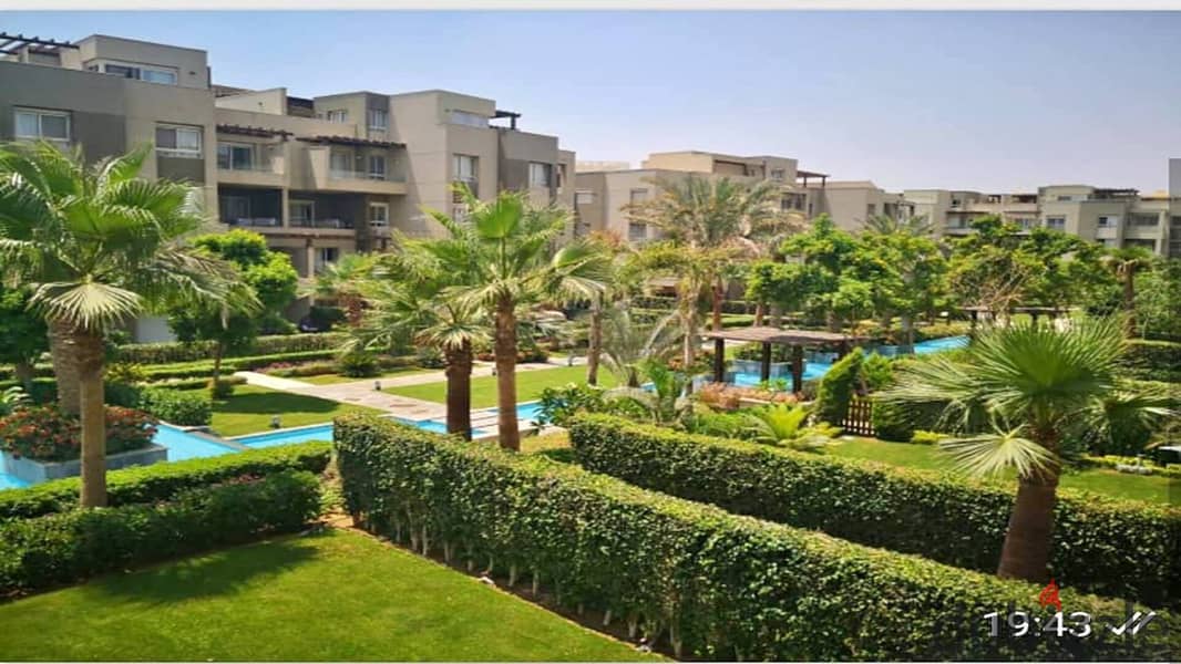 2 bedroom apartment for sale with open view of landscape and wide green spaces in Swan Lake Residence Compound, Hassan Allam, New Cairo, in front of R 4