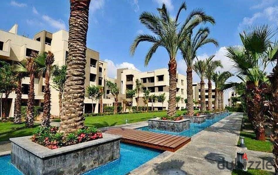 2 bedroom apartment for sale with open view of landscape and wide green spaces in Swan Lake Residence Compound, Hassan Allam, New Cairo, in front of R 9