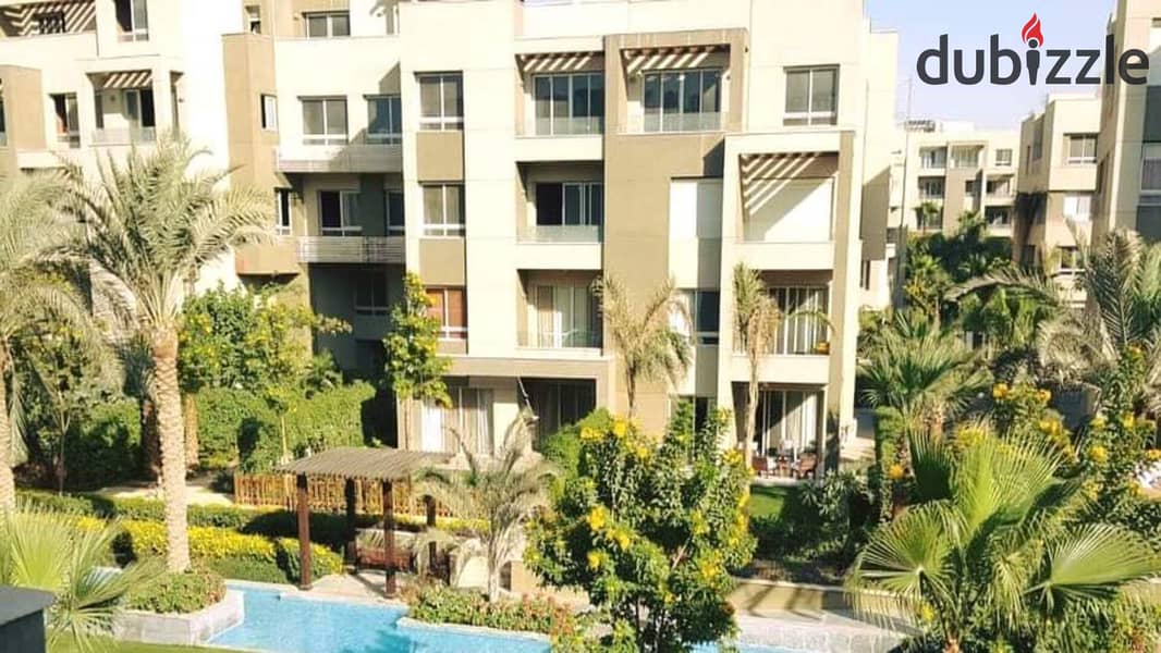 2 bedroom apartment for sale with open view of landscape and wide green spaces in Swan Lake Residence Compound, Hassan Allam, New Cairo, in front of R 11