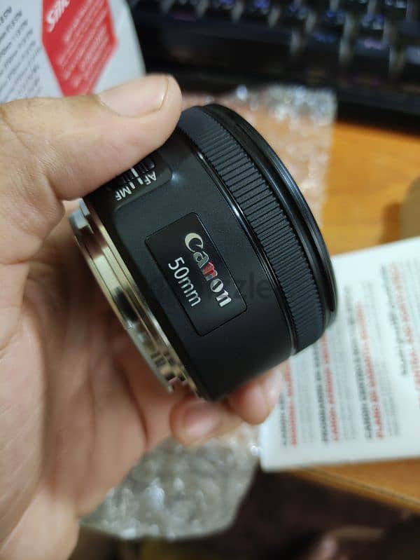 لينس كانون 50 مللي جديده زيرو Canon lens 50 mm STM open box بمشتملاتها 1