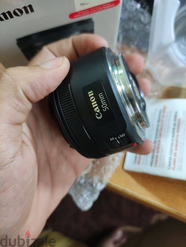 لينس كانون 50 مللي جديده زيرو Canon lens 50 mm STM open box بمشتملاتها 2