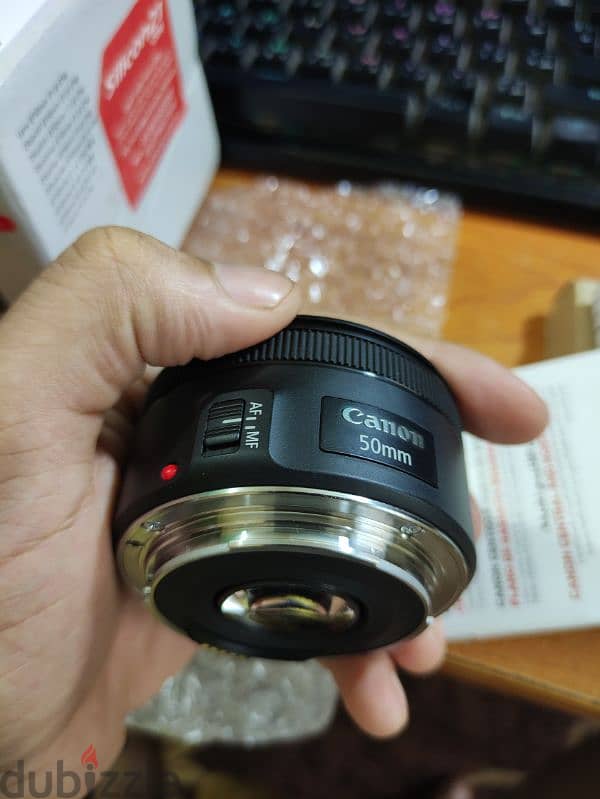 لينس كانون 50 مللي جديده زيرو Canon lens 50 mm STM open box بمشتملاتها 3