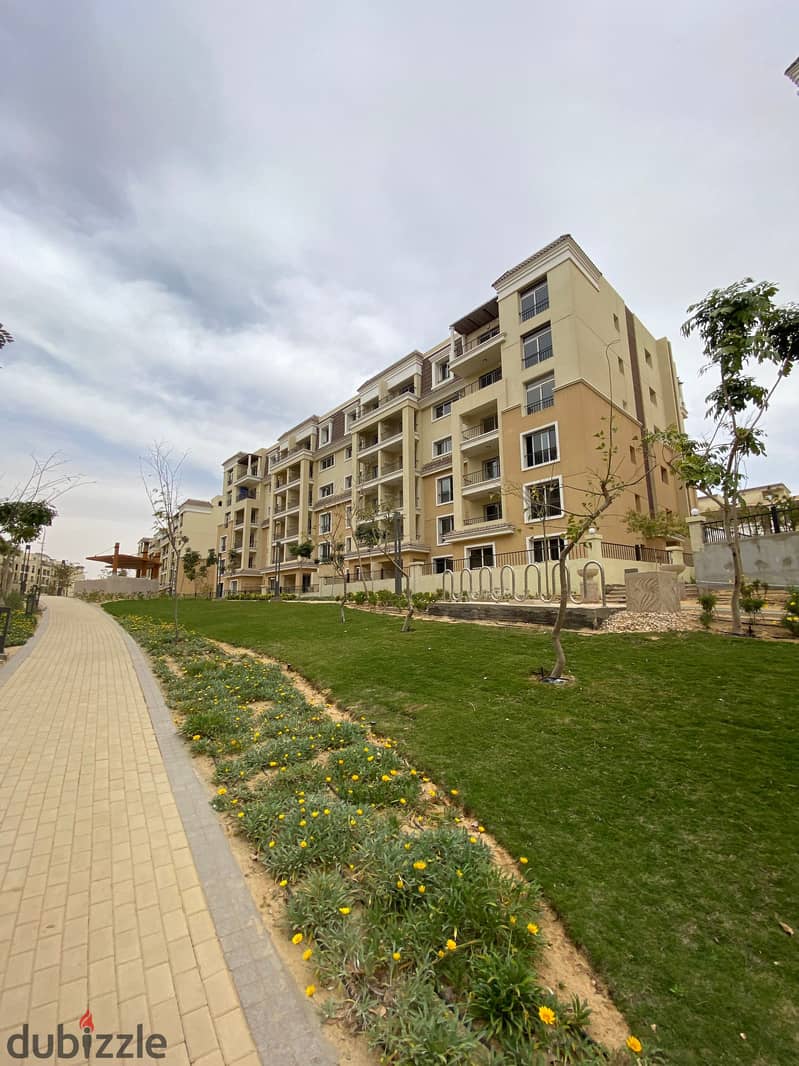 Required cash 420,000 thousand only, a 155-meter apartment in Sarai New Cairo Compound, in front of Al Shorouk, directly on the Suez Road and next to 8