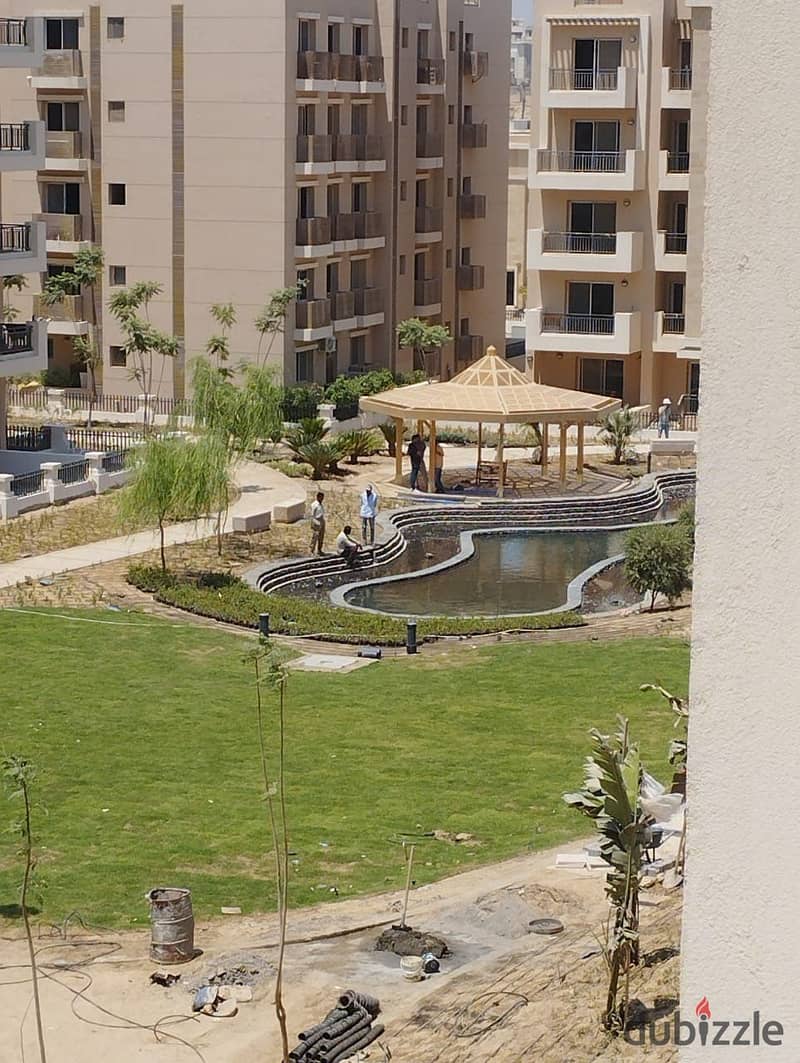 For sale, the last ground floor studio, 70 m + garden 99 m, in front of Cairo Airport, minutes from City Center, in Taj City 7