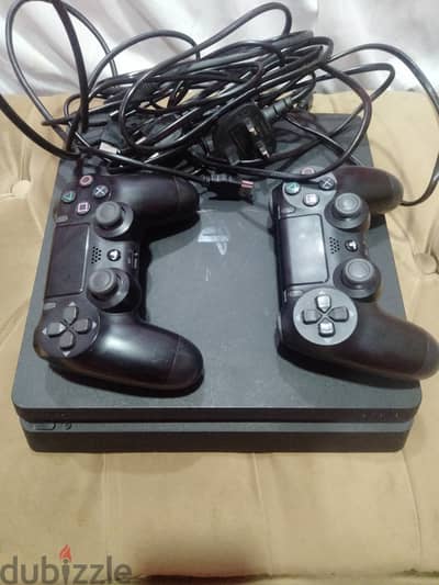 playstation 4 slim with 2 controllers