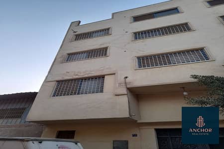 Fully Ready Licensed Factory 6 Floors for sale in industrial zone in Gesr Al Suez