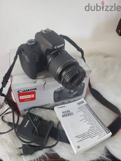 كاميرا كانون canon4000 D بكامل متعلقاتها والشنطه