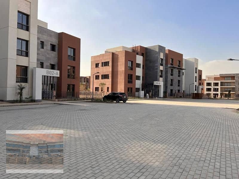 Delivered Apartment Terrace overlooking the landscape and club in District 5 Marakez New Cairo 3