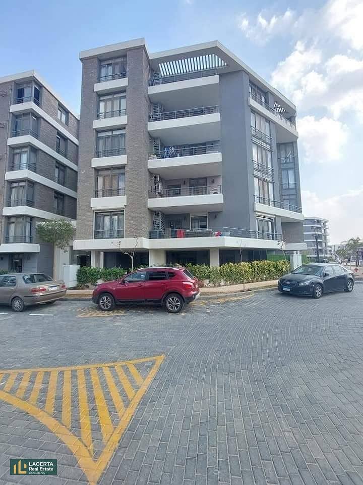 For sale, an apartment 57m in a garden with a cash discount of 42% + installments on Suez Road in front of Cairo Airport in the Taj City Compound 3