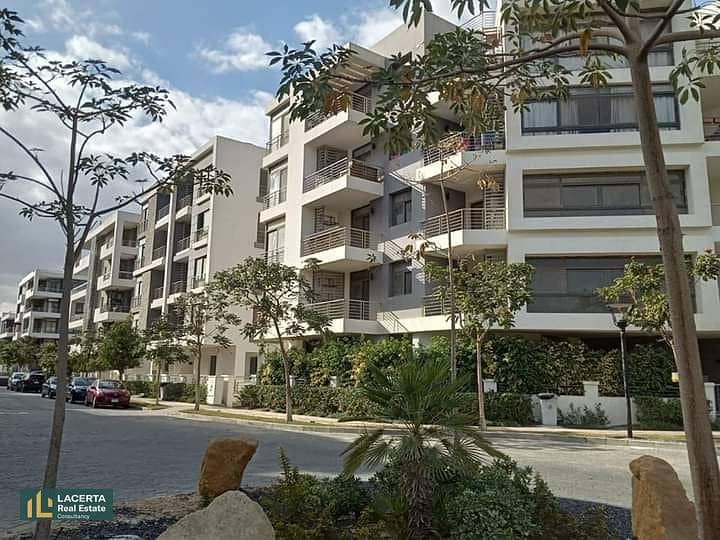 For sale, an apartment 57m in a garden with a cash discount of 42% + installments on Suez Road in front of Cairo Airport in the Taj City Compound 4