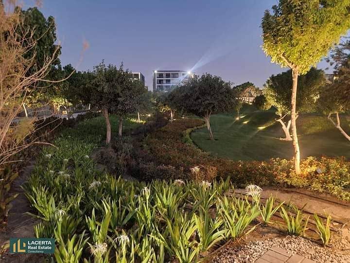 For sale, an apartment 57m in a garden with a cash discount of 42% + installments on Suez Road in front of Cairo Airport in the Taj City Compound 6