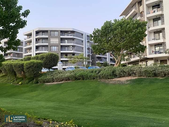 For sale, an apartment 57m in a garden with a cash discount of 42% + installments on Suez Road in front of Cairo Airport in the Taj City Compound 7