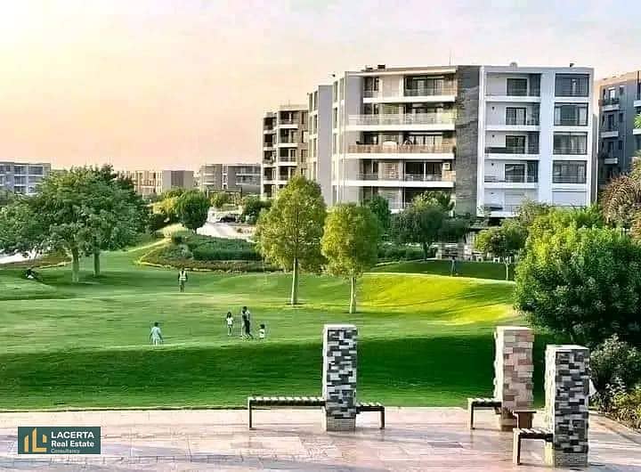 For sale, an apartment 57m in a garden with a cash discount of 42% + installments on Suez Road in front of Cairo Airport in the Taj City Compound 9