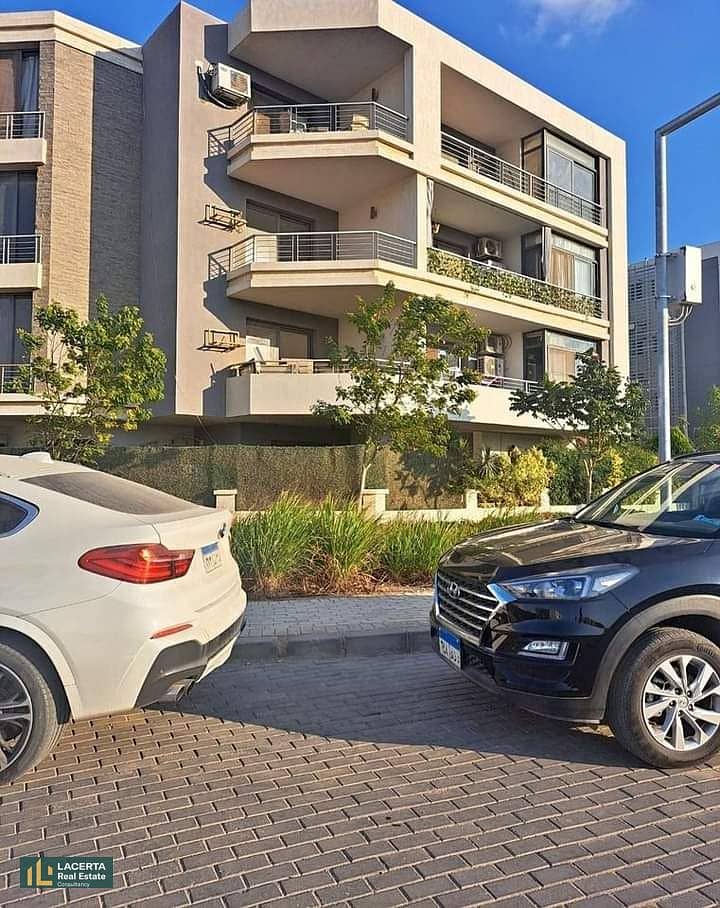 For sale, an apartment 57m in a garden with a cash discount of 42% + installments on Suez Road in front of Cairo Airport in the Taj City Compound 11