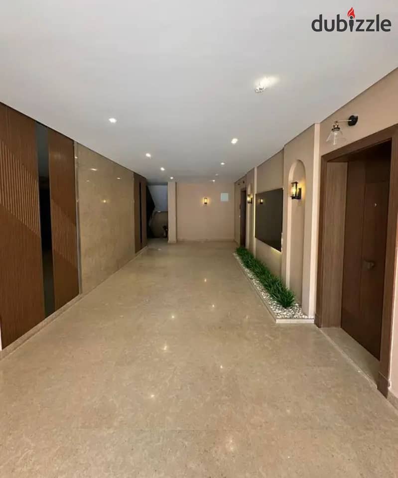 Live immediately in VILLAGE WEST in a fully finished penthouse with air conditioners in installments in Old Sheikh Zayed 4