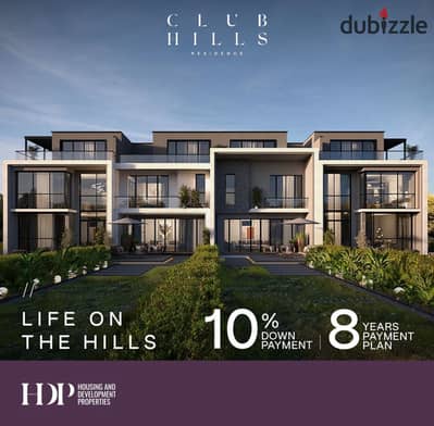 Live in a villa with a landscape view in front of Al-Jazira Club, with installments over 8 years from CLUB HILLS