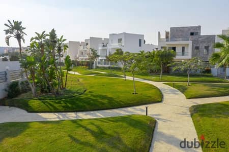 Twin villa for immediate delivery with a garden area of ​​234 square meters, directly on the axis in Sheikh Zayed, in installments