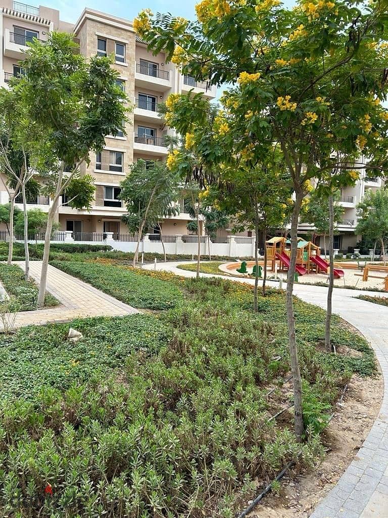 Apartment for sale with a private garden in front of Kempinski Hotel in Taj City Compound 7