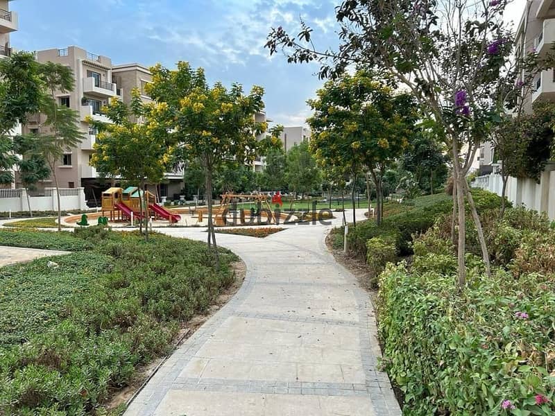 Apartment for sale with a private garden in front of Kempinski Hotel in Taj City Compound 9