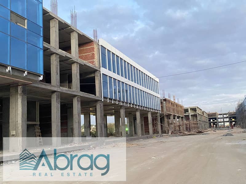 For sale, a commercial store, 125 square meters, immediate delivery, with facilities up to 4 years, West Eleven Mall, in front of Misr University 10