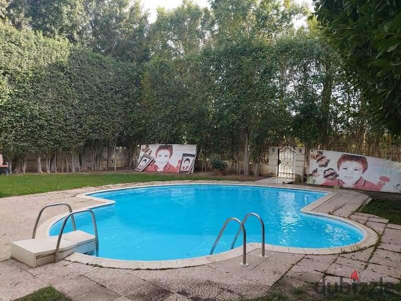 Private villa for sale, 750 square meters, with a swimming pool and a large private garden, next to Mall of Egypt, Wadi Degla Club, and on Al Wahat Ro 3