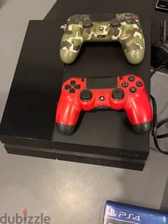 PlayStation 4 with 2 controllers and 3 games 0