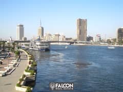 شقة فندقية 430 م للبيع بالتقسيط ف ابراج نايل بيرل فندق هيلتون بفيو بنورامي علي النيل / Hilton Nile Pearl 0