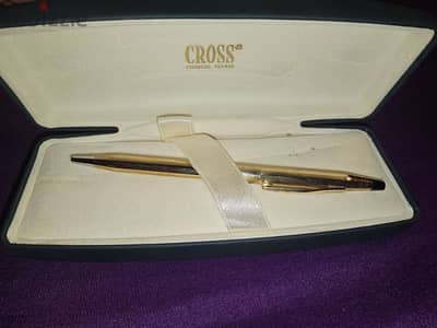 cross pen filled with gold