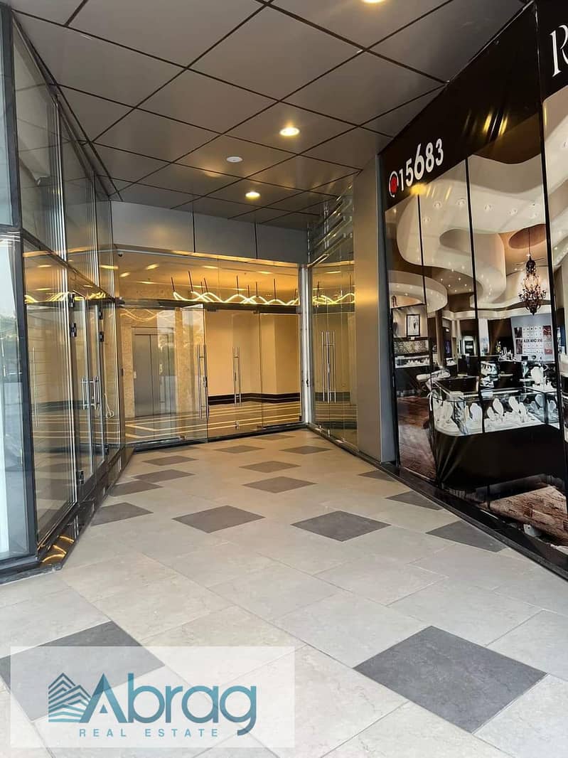 For sale, a 50-meter commercial shop, immediate delivery, with a distinctive view, Ritzy Mall, Sheikh Zayed 1