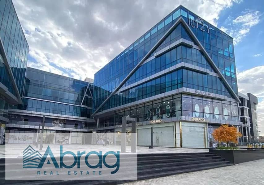 For sale, a 50-meter commercial shop, immediate delivery, with a distinctive view, Ritzy Mall, Sheikh Zayed 4